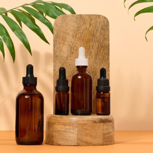 glass-bottle-for-cosmetics-oils-with-a-pipette-on-RYU49AC.jpg